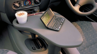 Ford Actually Offered This Shifter-Mounted Driver's Work Table In The 1990s And It's Just Amazing